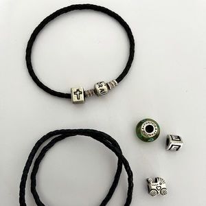 Original Pandora bracelets. One is double. Color black both with four charms.